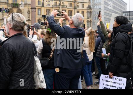 LONDON, UK 11th March 2024: As the Queen Consort Camilla represents the Royal Family at the Commonwealth Day Service at Westminster Abbey, outside protestors from Republic demonstrate against the institution of the monarchy. Protesters take pictures with their smart phones as guests arrive. Stock Photo