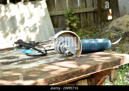 The grinder's tool was left lying on the workbench. Stock Photo