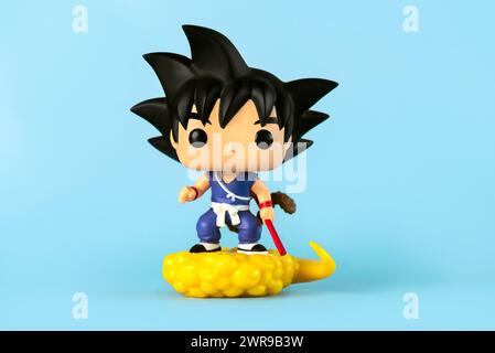 Funko POP vinyl figure of Son Goku & Flying Nimbus character of the Dragon Ball Z manga series created by Akira Toriyama over blue background. Illustr Stock Photo