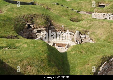 5000 year old Skara Brae stone-built Neolithic settlement, located on the Bay of Skaill, Orkney, Scotland Stock Photo