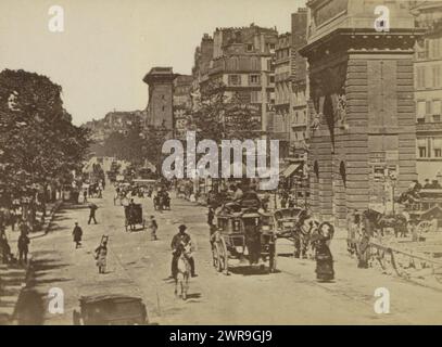 View of the Boulevard Saint-Martin and (right) the Porte Saint-Martin in Paris, Part of Photo album with cabinet photos of sights in Paris., anonymous, Paris, c. 1870, cardboard, albumen print, height 108 mm × width 165 mm, photograph Stock Photo