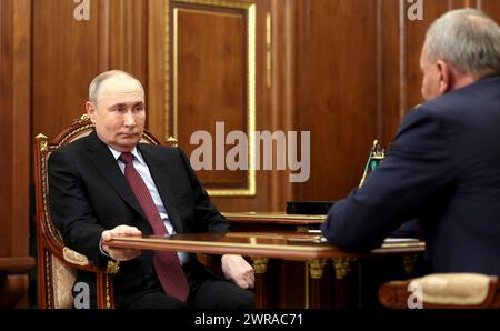 Moscow, Russia. 11th Mar, 2024. Russian President Vladimir Putin, left, holds a face-to-face working meeting with Russian state space agency Roscosmos Director General Yury Borisov, right, at the Kremlin, March 11, 2024 in Moscow, Russia. Credit: Mikhail Metzel/Kremlin Pool/Alamy Live News Stock Photo