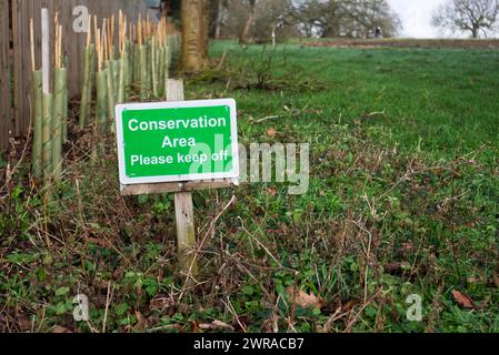 Conservation Area Please Keep Off Sign on Grass in Bromham, Bedfordshire Stock Photo