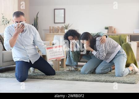 People with evacuation plan choking on smoke in burning building Stock Photo