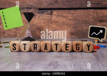 STRATEGY word made with building blocks. Stock Photo