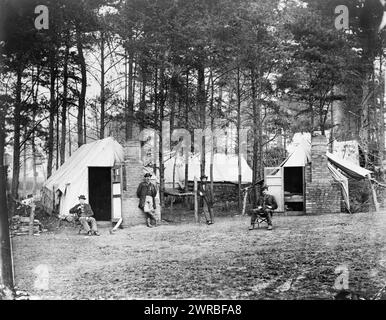 Quarters of Capt. Harry Clinton, Qt. Mst. of Provost Marshal Dept., Brandy Station, Virginia, Capt. J.R. Coxe, Capt. Harry P. Clinton and two other men posed in camp., 1864, Military camps, Virginia, Brandy Station, 1860-1870, Group portraits, 1860-1870., Portrait photographs, 1860-1870, Group portraits, 1860-1870, 1 photographic print Stock Photo