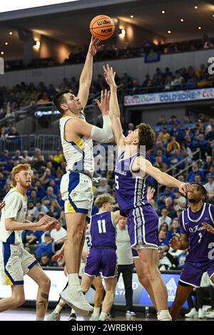 South Dakota State Jackrabbits forward Luke Appel (13) shoots over defender St. Thomas - Minnesota Tommies forward Parker Bjorklund (5) during an NCAA men's basketball semi-final between the University of St. Thomas-Minnesota Tommies and the South Dakota State Jackrabbits during the Summit League Championships at the Denny Sanford PREMIERE Center in Sioux Falls, SD on Monday, March 11, 2024. Russell Hons/CSM Stock Photo