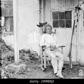 Gettysburg, Pennsylvania. John L. Burns, the 'old hero of Gettysburg,' with gun and crutches, Brady's National Photographic Portrait Galleries, photographer, 1863 July., United States, History, Civil War, 1861-1865, Glass negatives, 1860-1870., Stereographs, 1860-1870, Glass negatives, 1860-1870, 1 negative (2 plates): glass, stereograph, wet collodion Stock Photo