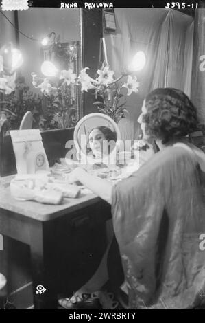 Anna Pavlowa, Photograph shows Russian ballerina Anna Pavlova (Pavlovna) (1881-1931), seated at a dressing table., between ca. 1910 and ca. 1915, Glass negatives, 1 negative: glass Stock Photo