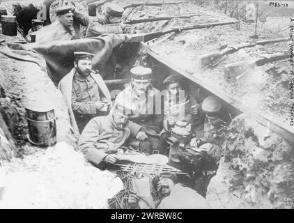 A quiet moment in German trenches, Photograph shows German soldiers smoking and reading in a trench in Flanders, Belgium, during World War I., between 1914 and ca. 1915, World War, 1914-1918, Glass negatives, 1 negative: glass Stock Photo