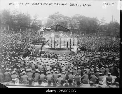 Military at Wrestling match at Yasukuni Shrine, Japan, Photograph shows a wrestling match at the Yasukuni Shrine, a Shinto shrine in Chiyoda, Tokyo, Japan which honors people who died serving Japan and is the site of annual sumo wrestling matches., 1916 April 19, Glass negatives, 1 negative: glass Stock Photo