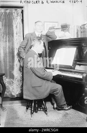 F. Kreisler & R. Warlich, Photograph shows violinist and composer Fritz Kreisler (1875-1962) at the piano and baritone singer Reinhold Wahrlich (1877-1939). Kreisler accompanied Wahrlich at a recital in New York in Dec. 1916., between ca. 1915 and 1916, Glass negatives, 1 negative: glass Stock Photo