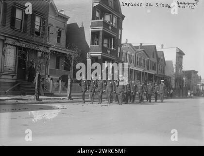 Bayonne Oil Strike, Photograph shows police marching down street during labor activism by refinery workers in Bayonne, New Jersey., 1916?, Glass negatives, 1 negative: glass Stock Photo