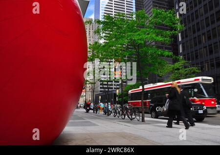 Toronto, Ontario, Canada - 06/12/2009: Red - RedBall art display in Toronto with a red streetcar in the background Stock Photo