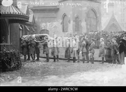 Vernon Castle funeral, Photograph shows funeral of ballroom dancer Vernon Castle (1887-1918) who died in an airplane crash during World War I while serving as a captain in the Royal Flying Corps, teaching airmen to fly in Texas. His widow, ballroom dancer Irene (Foote) Castle (1893-1969) stands in line behind coffin, with veil over her face. The funeral took place on February 19, 1918 in New York City., 1918 Feb. 19, Glass negatives, 1 negative: glass Stock Photo