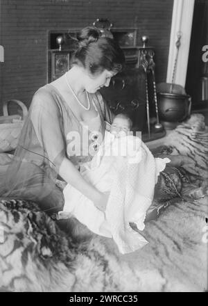 Alma Gluck & baby, Photograph shows Romanian-American opera singer Alma Gluck (1884-1938) and her baby Efrem Zimbalist Jr. (1918-2014) on a tiger skin rug., 1918 or 1919, Glass negatives, 1 negative: glass Stock Photo