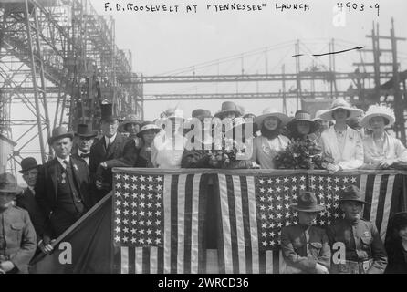 F.D. Roosevelt at 'Tennesee' launch, Photograph shows Assistant Secretary of the Navy, Franklin Delano Roosevelt (1882-1945) (left, wearing top hat) at the launching of the U.S.S. Tennessee at the Brooklyn Navy Yard, April 30, 1919. Also shown are Helen Lenore Roberts (center, white hat, holding bouquet) and her father Tennessee Governor A.H.Roberts (standing to left of Roosevelt)., 1919 April 30, Glass negatives, 1 negative: glass Stock Photo