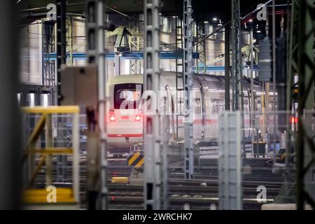 Berlin, Germany. 12th Mar, 2024. A train stands in the ICE works at the Rummelsburg depot. The German Train Drivers' Union (GDL) has called for another 24-hour strike in the collective bargaining dispute at Deutsche Bahn for passenger and freight transport. Credit: Christoph Soeder/dpa/Alamy Live News Stock Photo