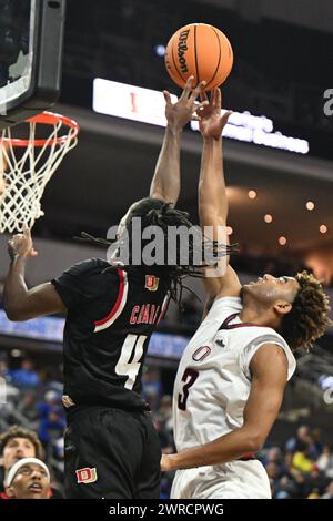 Denver Pioneers guard DeAndre Craig (4) shoots a three pointer during ...