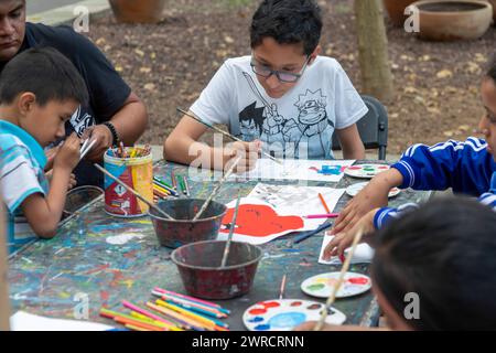 Oaxaca, Mexico - Students painting at a temporary art class in the zocalo. Stock Photo