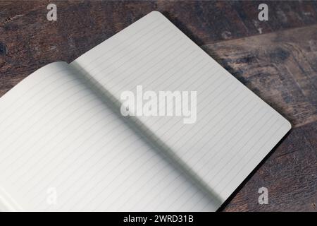 An open notebook for writing, blank sheets. wooden vintage table surface Stock Photo
