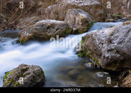 beautiful mountain rapid flowing through the rocks in Apuseni mountains Stock Photo