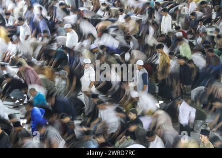 Lhokseumawe, Indonesia. 11th Mar, 2024. Indonesian Muslim people perform the first Tarawih prayer at Islamic Center Mosque in Lhokseumawe, Aceh Province, Indonesia, March 11, 2024. Credit: Fachrul Reza/Xinhua/Alamy Live News Stock Photo