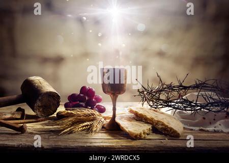 Last Supper Of Jesus With Passion Objects - Communion And Calvary - Holy Grail And Bread With Crown Of Thorns Stock Photo