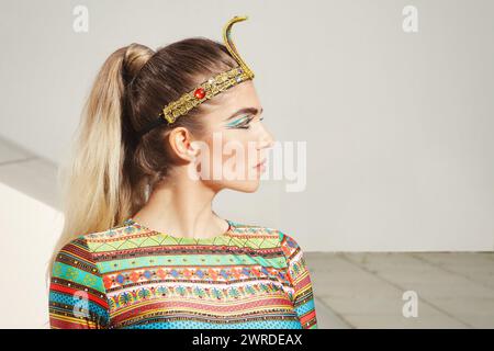 Fitness beauty in costume of Egypt princess posing outdoor Stock Photo