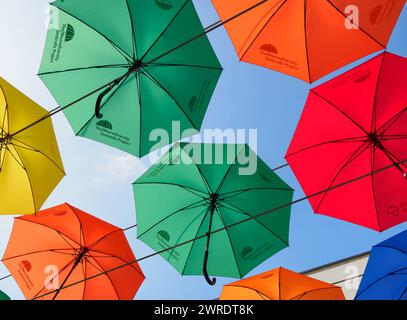 Liverpool University campus Merseyside UK, brightly colored umbrellas representing diversity Stock Photo