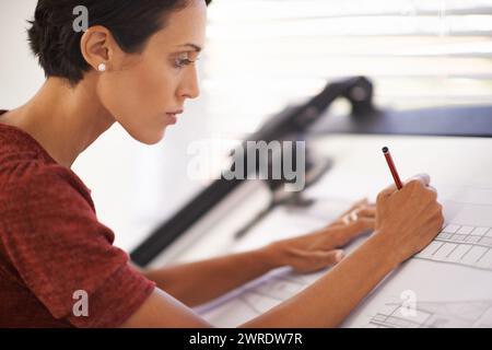 Woman, architecture with drawing and blueprint for construction, focus on design with pencil and engineering. Architect, contractor and sketch floor Stock Photo