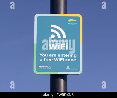 Sign on a post informing the public that they are entering a free wifi zone. Aldeburgh. UK Stock Photo