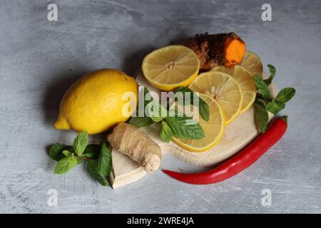 Lemons and mint leaves. Still life with organic fruit. Eating healthy concept. Natural antioxidants. Stock Photo