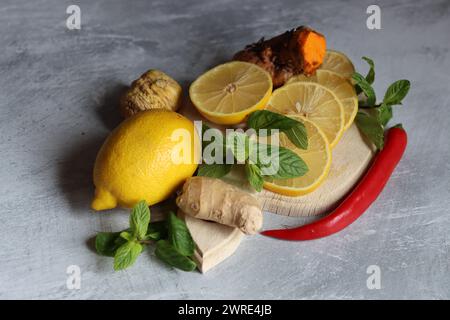 Lemons and mint leaves. Still life with organic fruit. Eating healthy concept. Natural antioxidants. Stock Photo