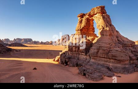 Landscape of the Red Tadrart in the Sahara Desert, Algeria. Aerial view of one of the arches of Tamesguida Stock Photo