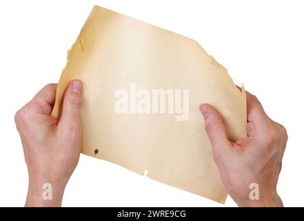 Man holding a sheet of old yellow paper in his hands. Isolated on white Stock Photo