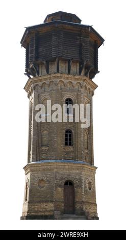 The old city water tower is made of yellow bricks and wood.  Isolated on white Stock Photo