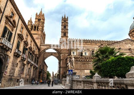 Palermo, Italy - May 13, 2023: Facade of the cathedral of Palermo with people around in the old town of Palermo, Sicily, Italy Stock Photo