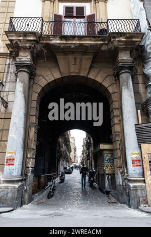 Palermo, Italy - May 13, 2023: Street of the old town of Palermo with people around in Sicily, Italy Stock Photo