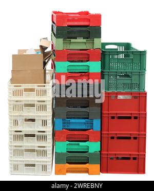 Used plastic boxes containers for fruits, vegetables and food. Isolated on white Stock Photo