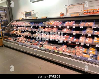 Wares with meat products, butcher's section in a dutch supermarket Stock Photo