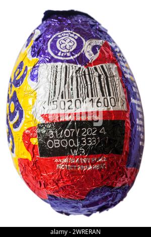 Cadbury classic creme egg showing barcode and best before date foil wrapped isolated on white background Stock Photo