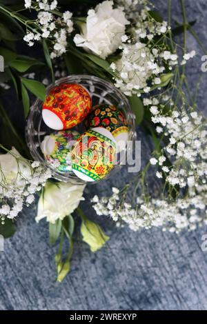 Decorated Easter eggs close up photo. Christian religion symbol. Holidays and celebration concept. Colorful eggs on textured background Stock Photo