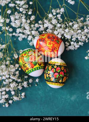 Decorated Easter eggs close up photo. Christian religion symbol. Holidays and celebration concept. Colorful eggs on textured background Stock Photo