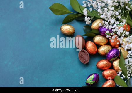 Easter greeting card. Colorful still life with eggs and flowers. Stock Photo