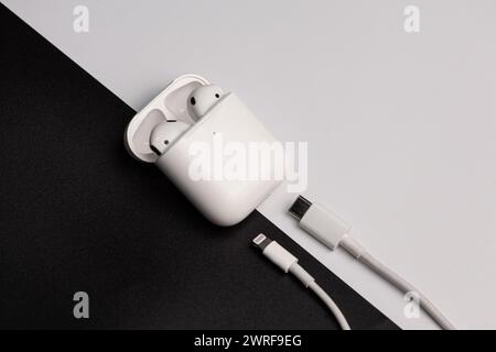 A set of airpods that are on a black and white background.Moldova,Hincesti,11.09.2023 Stock Photo
