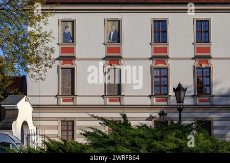 WROCLAW, POLAND - NOVEMBER 4, 2023: This is a fragment with portraits in windows of the building of the University Library On Sand. Stock Photo