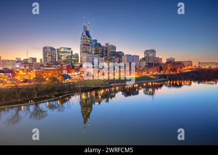 Nashville, Tennessee, USA. Cityscape image of Nashville, Tennessee, USA downtown skyline with reflection of the city the Cumberland River at spring su Stock Photo