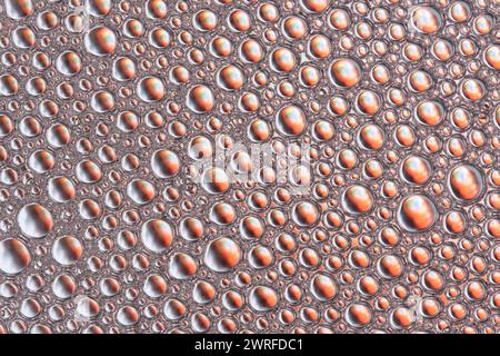 Abstract orange macro background with lots of soap bubbles Stock Photo