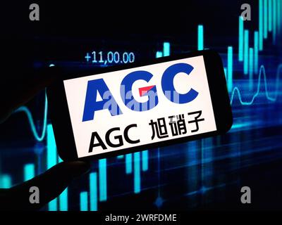 Konskie, Poland - March 11, 2024: AGC company logo displayed on mobile phone Stock Photo